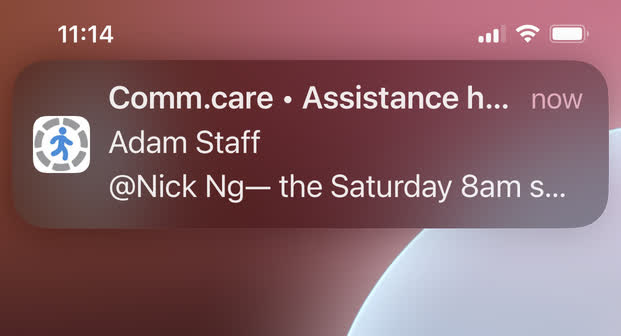 A Comm.care vacant shift alert arriving on an iPhone lock screen